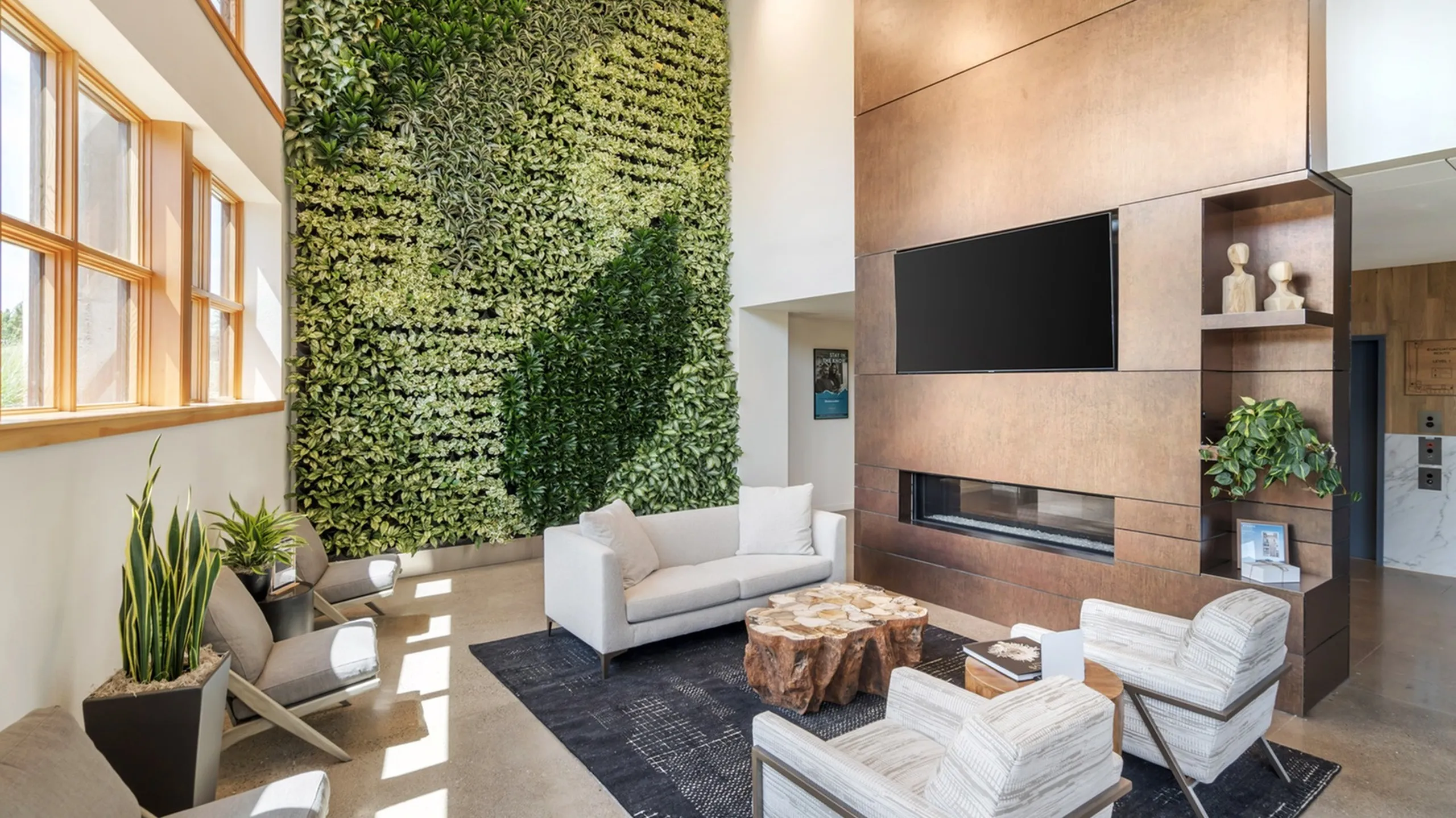 Stylish community lobby with living wall at The Current luxury apartments in Bend, OR