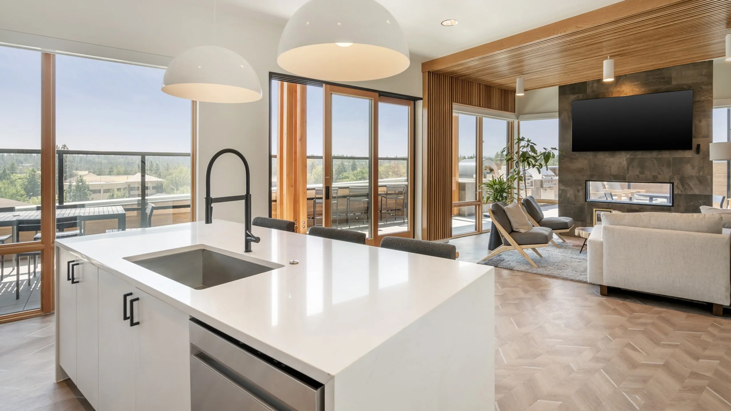 Modern community kitchen with stainless appliances at The Current luxury apartments in Bend, OR