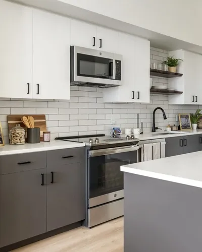 Fully-equipped kitchen with quartz countertops at The Current luxury apartments in Bend, OR