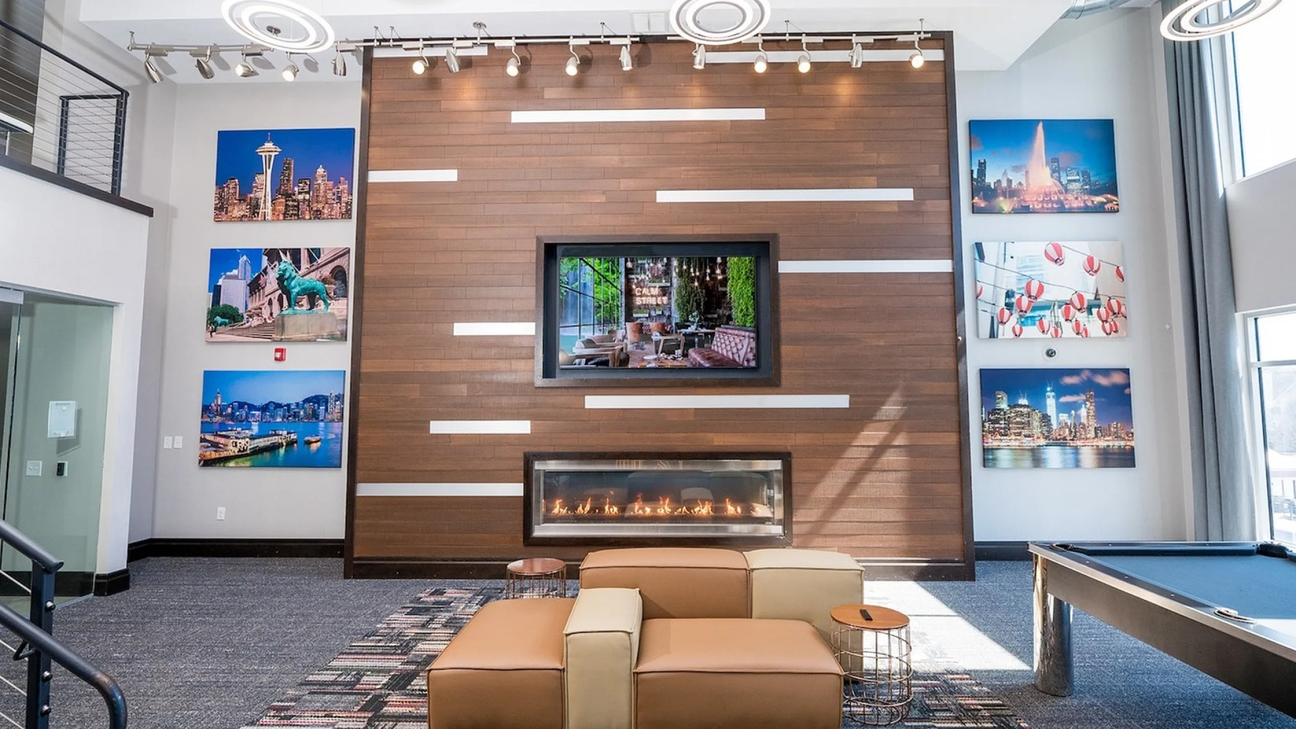 Campus Circle Urbana clubhouse lounge front TV view with comfortable gathering space for students in Urbana Illinois