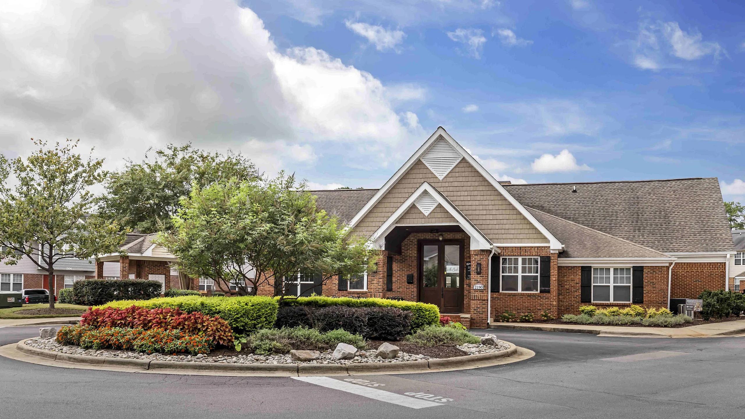 Front entrance of University Suites townhome-style student apartments in Raleigh North Carolina