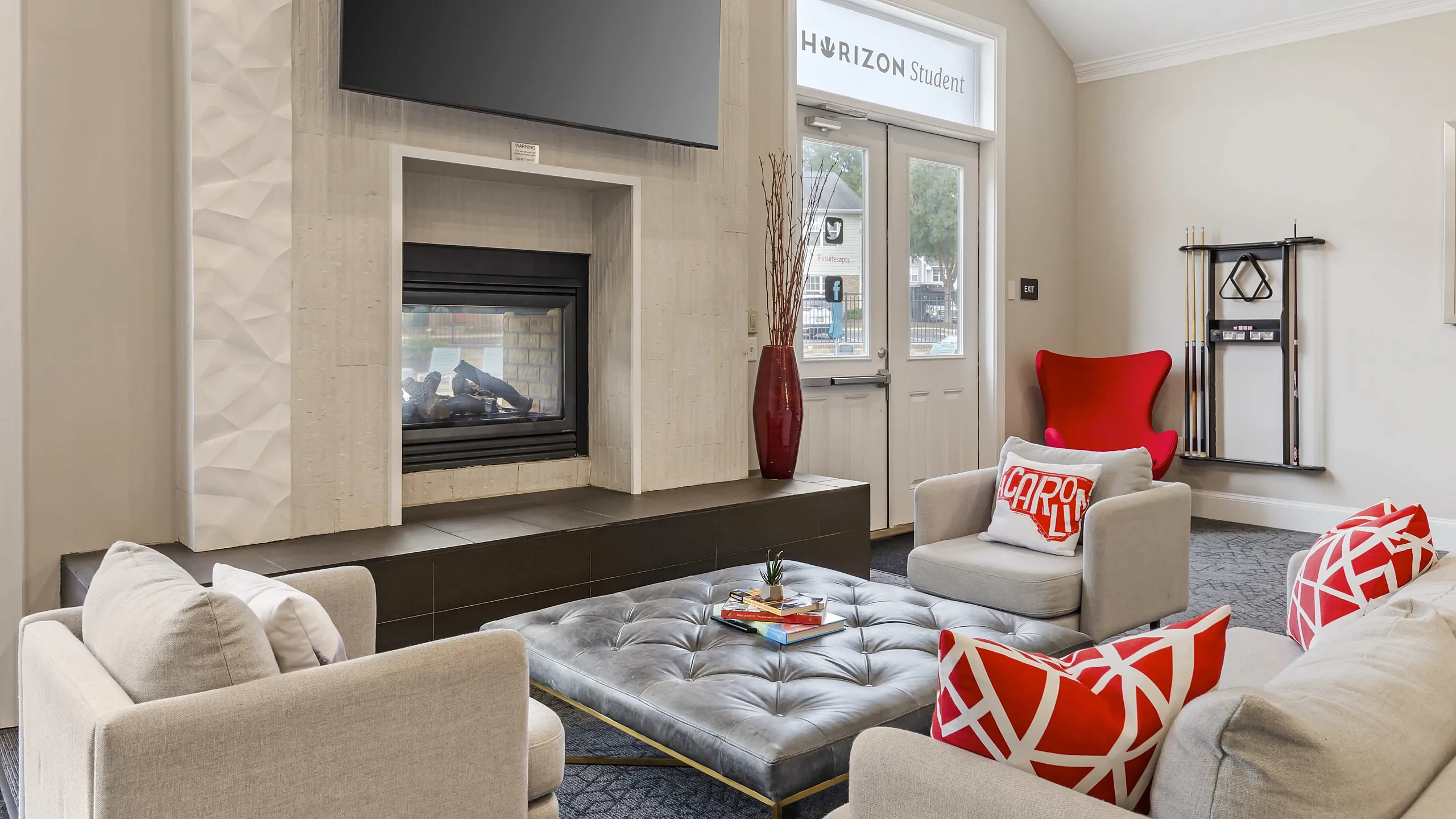 Clubhouse lounge with stylish seating at University Suites student apartments in Raleigh NC