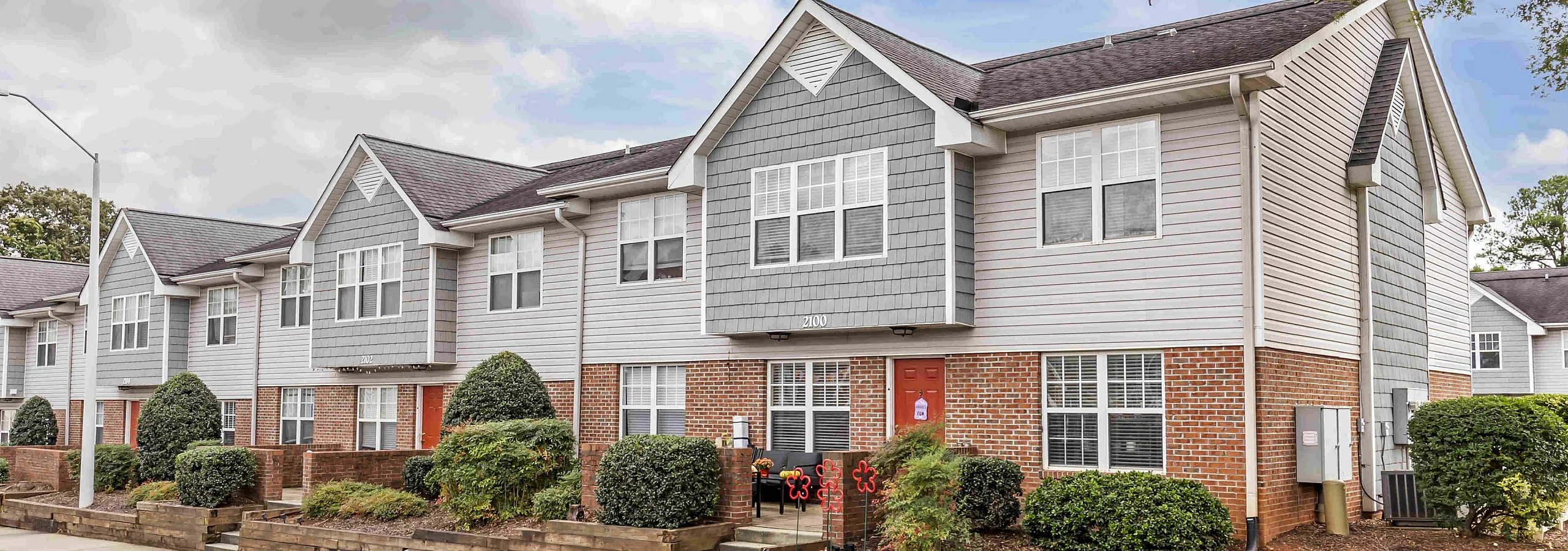 Townhome-style exterior buildings at University Suites student apartments in Raleigh North Carolina