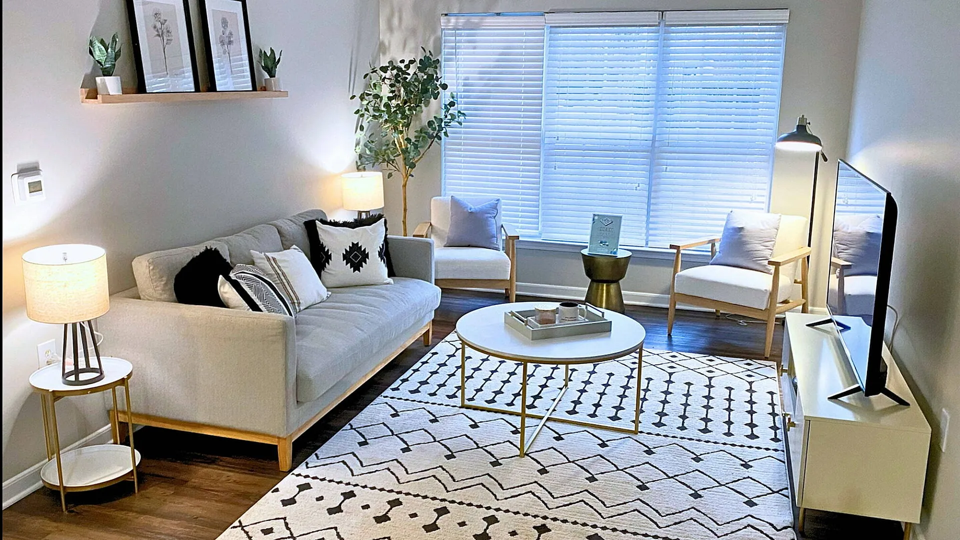 Inviting living room with modern decor, cozy seating, and natural light.