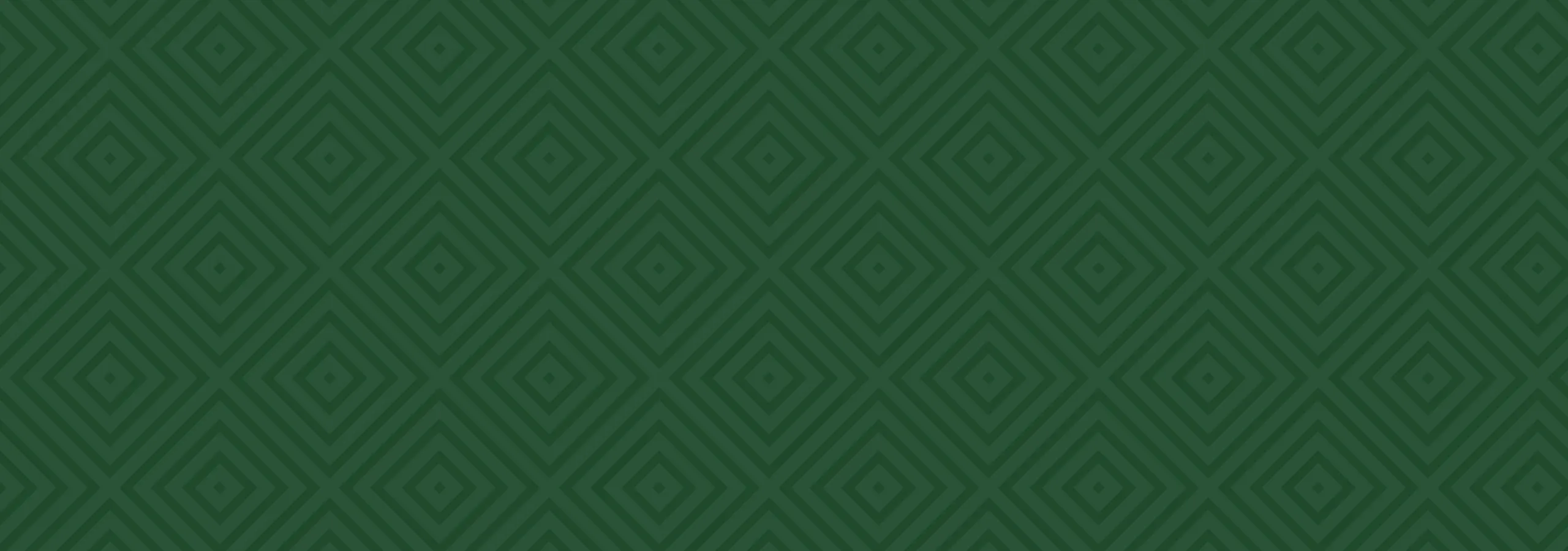 Elegant geometric pattern with green diamond shapes creating a luxurious wallpaper effect.
