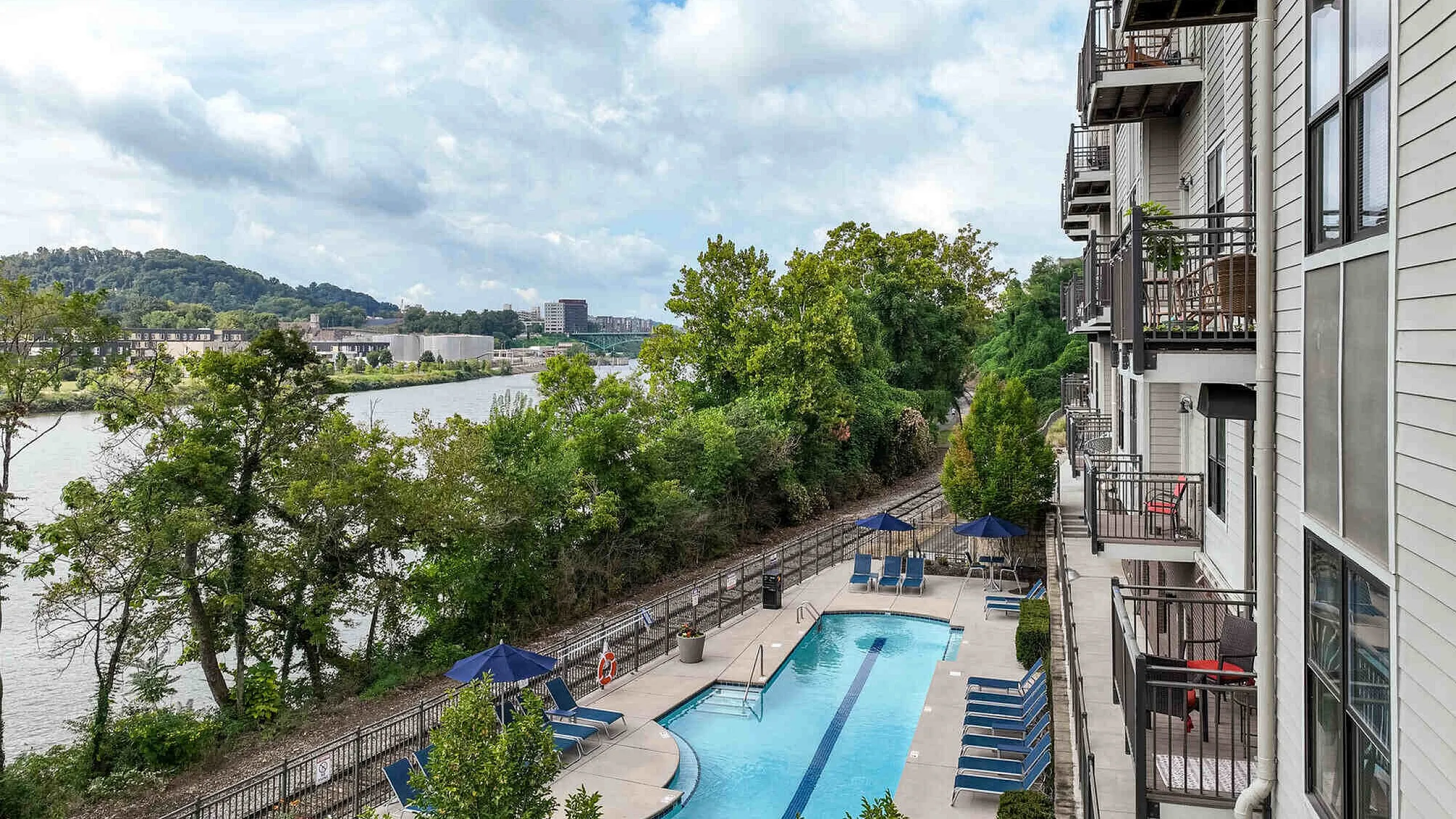 Balcony view overlooking resort-style saltwater pool and Tennessee River at The Landings riverside apartments Knoxville TN