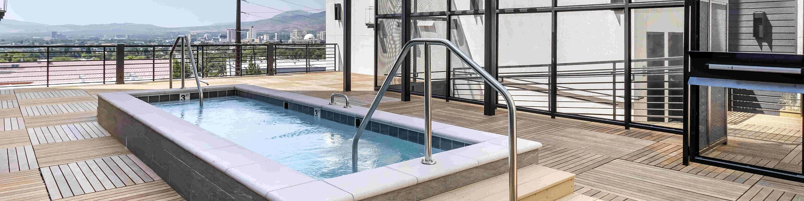Resort-style hot tub on rooftop deck at The Edison luxury apartments in Reno, NV