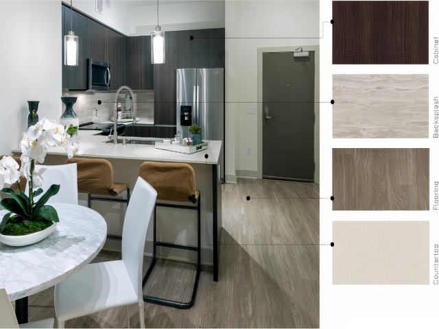 Material swatches next to an image of a kitchen with soft, warm finishes: dark brown wood cabinets, striated beige stone backsplash, tapue brown wood floors, and shiny ivory quartz counter.