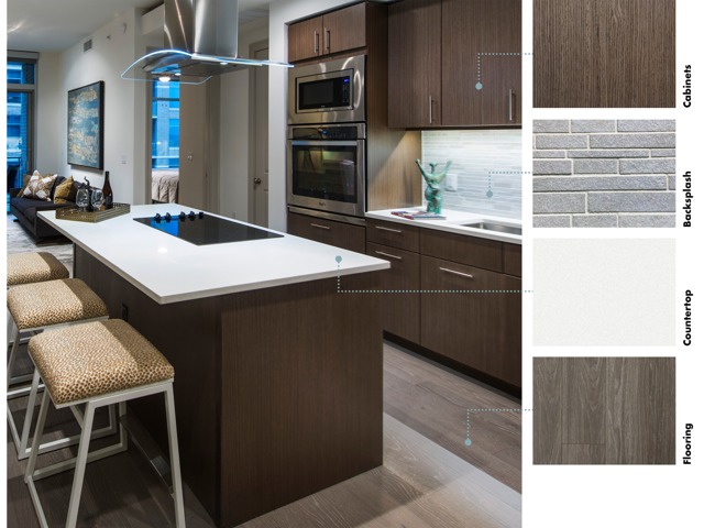 Material swatches next to an image of a kitchen with warm, high-contrast finishes: dark brown wood cabinets, textured gray stone backsplash, shiny white quartz counter, and beige wood-style floors.