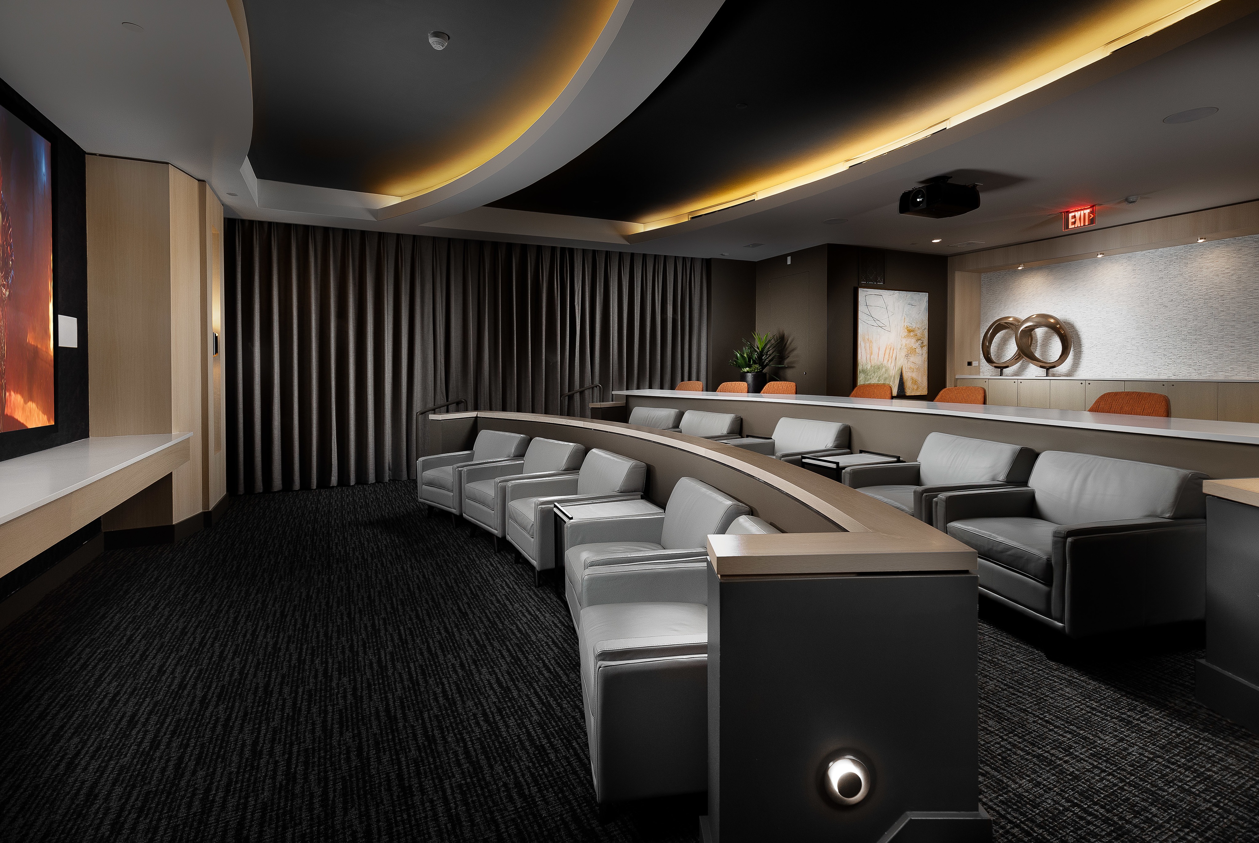 Private Media Room Featuring an Impressive HD Projector and Theater-Style Seating