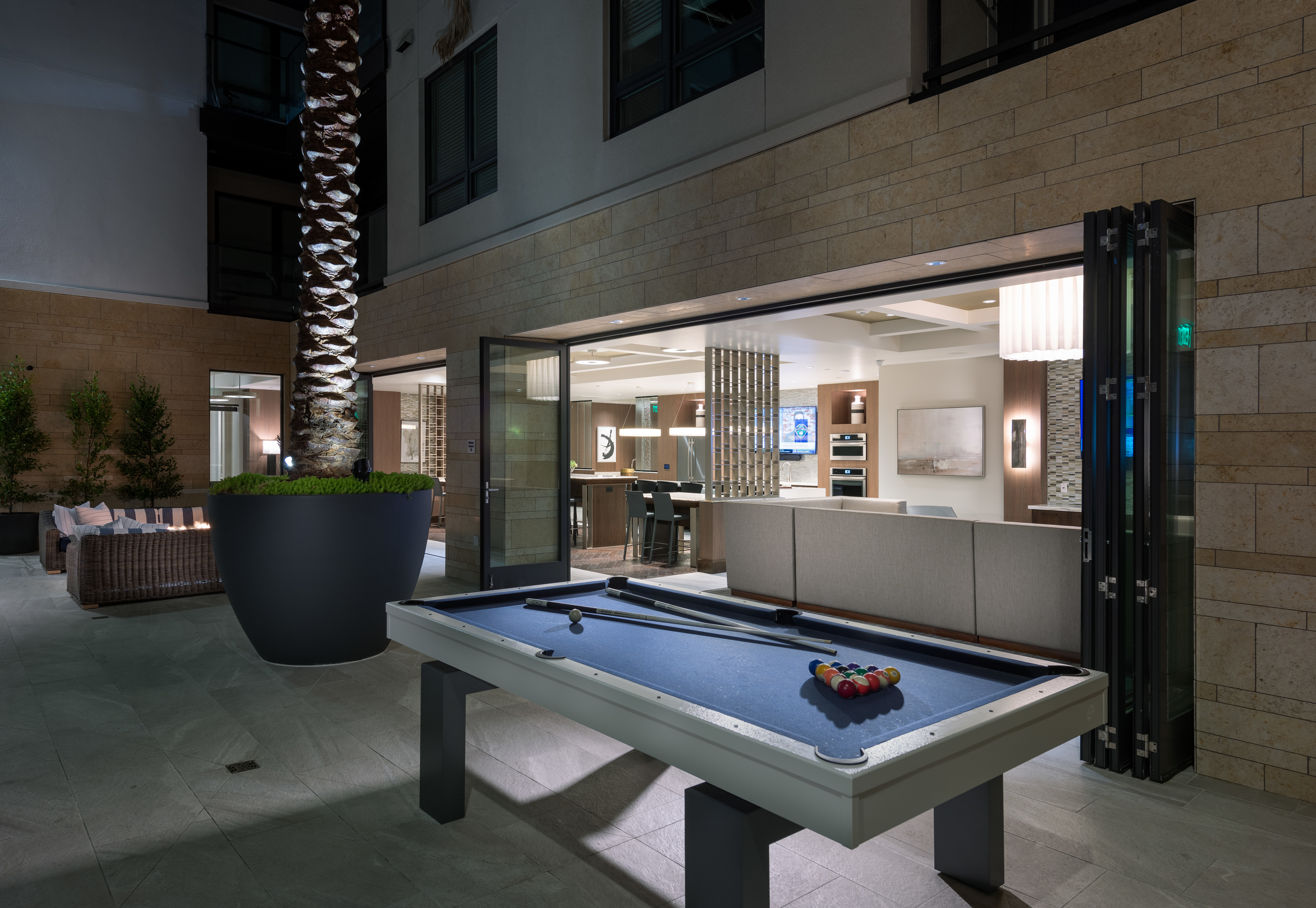 Open-air billiards lounge with outdoor seating, billiards table and firepit at Hanover Northgate