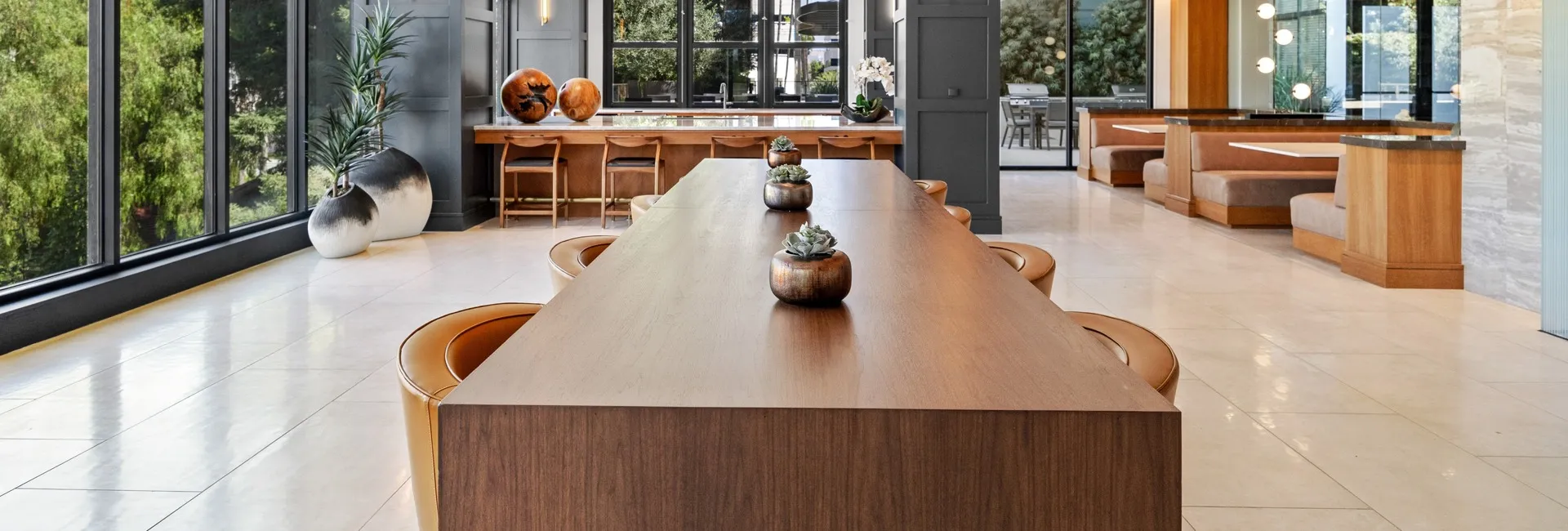 Entertaining kitchen and coworking area with communal and booth seating