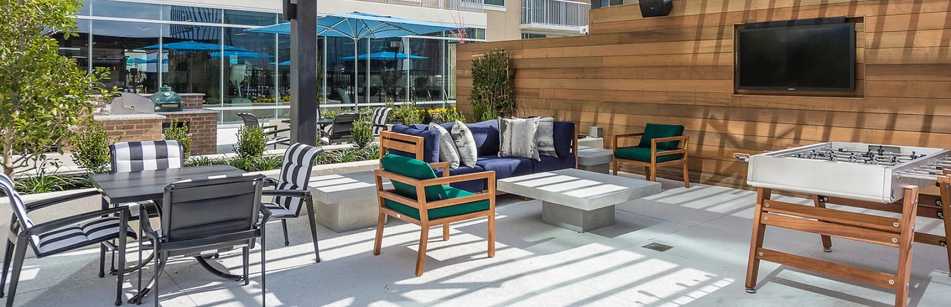 Chic outdoor patio with stylish wooden pergola, cozy seating area, and sleek modern amenities perfect for relaxation.