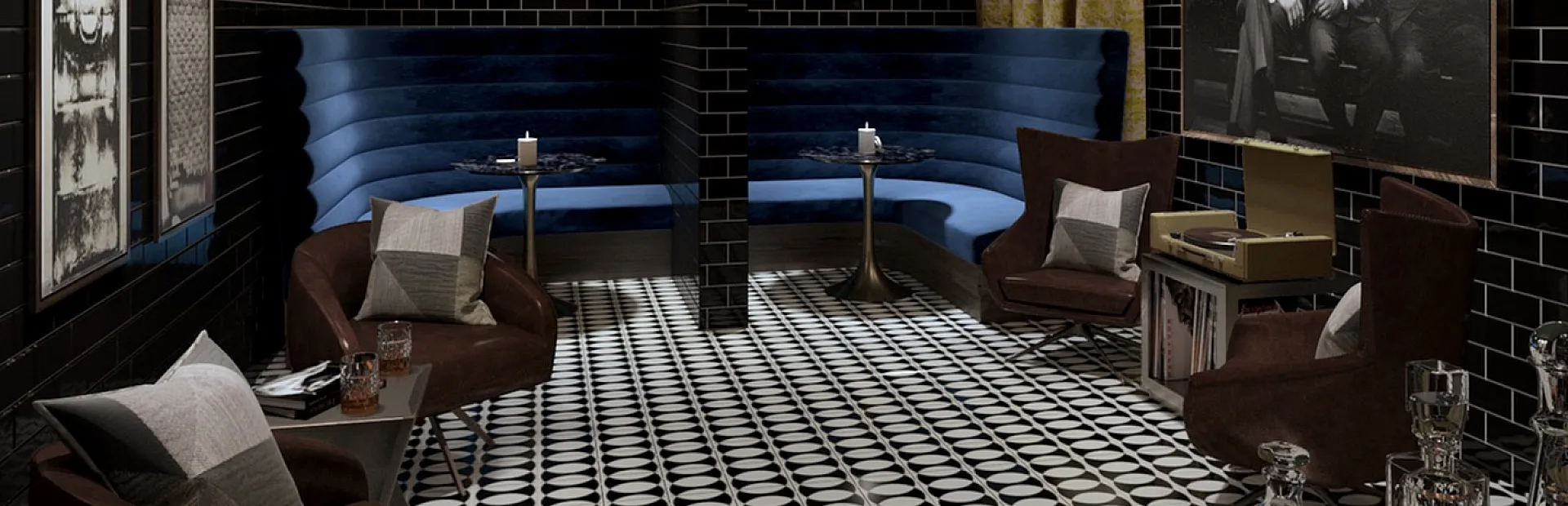 Chic lounge with stylish decor, featuring dark tiled walls, plush blue booths, and geometric patterned floors for a luxurious ambiance.