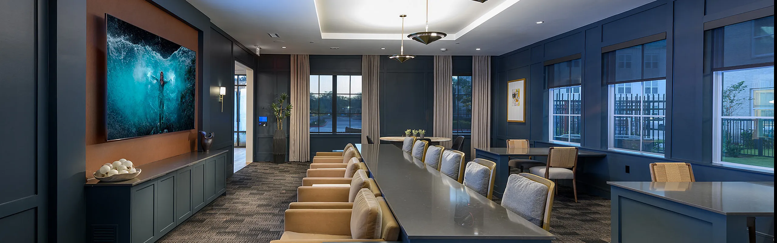 Elegant and contemporary meeting room with plush seating, stylish decor, and abundant natural light, ideal for gatherings or work sessions.
