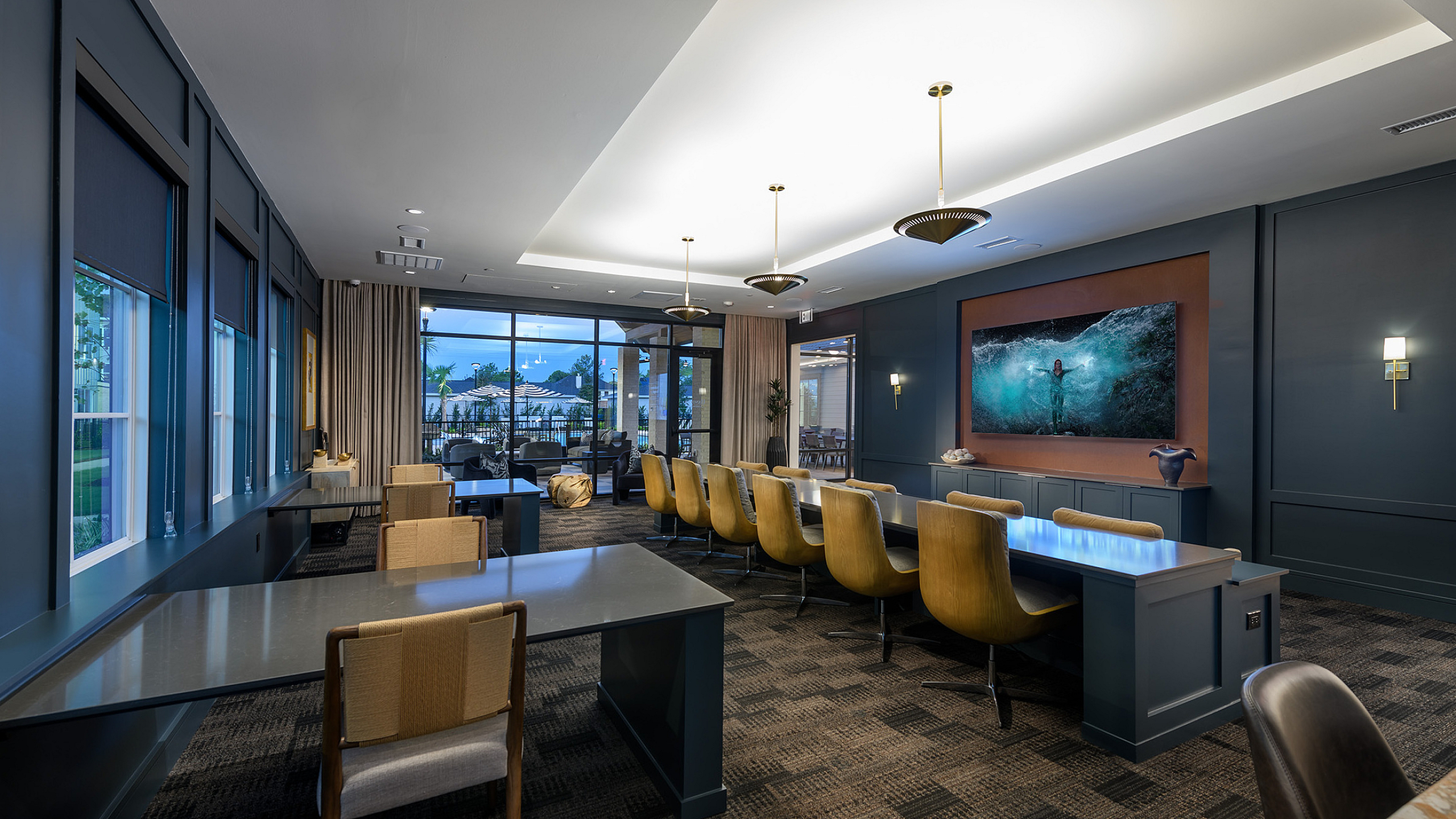 Elegant communal lounge with modern design, featuring luxurious seating, ambient lighting, and a captivating outdoor view.
