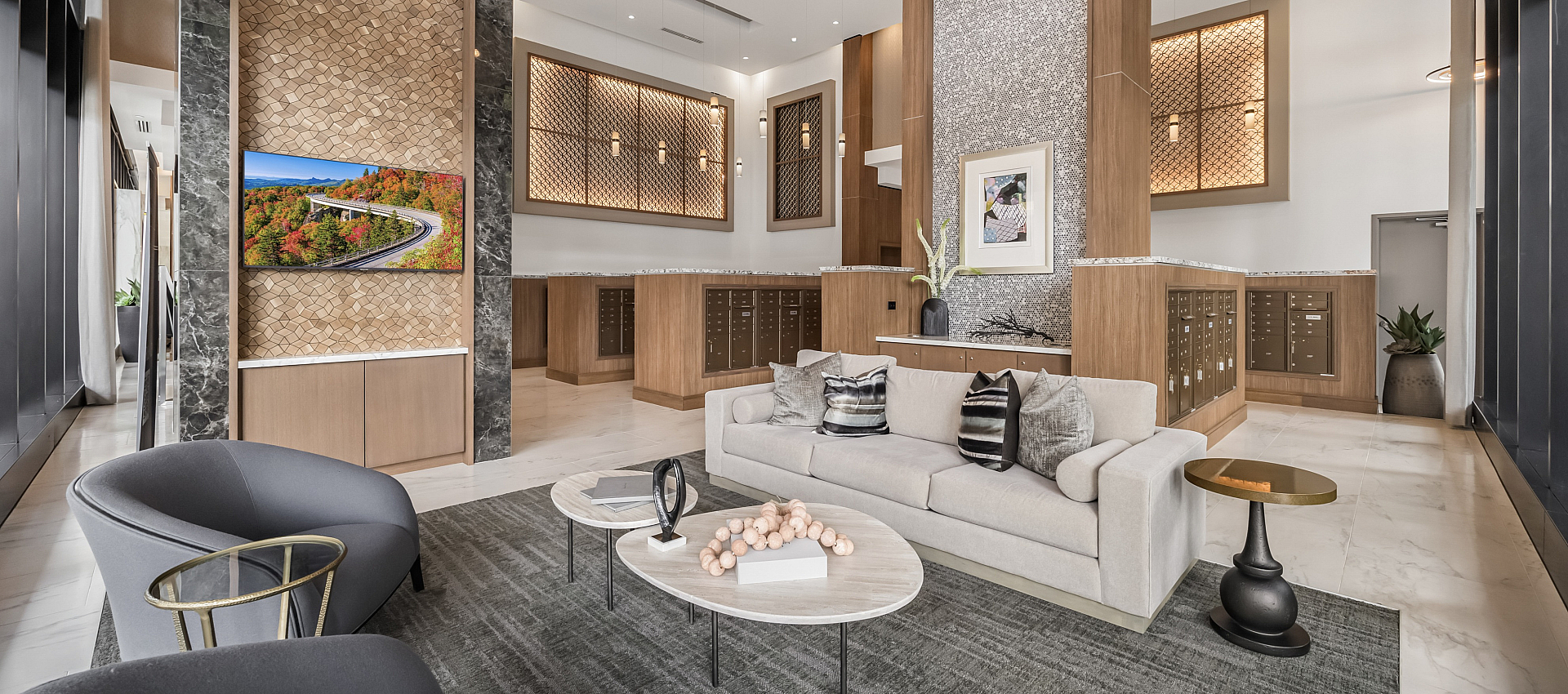 Elegant lobby area featuring modern furniture, stylish decor, and warm wood accents creating an inviting atmosphere.