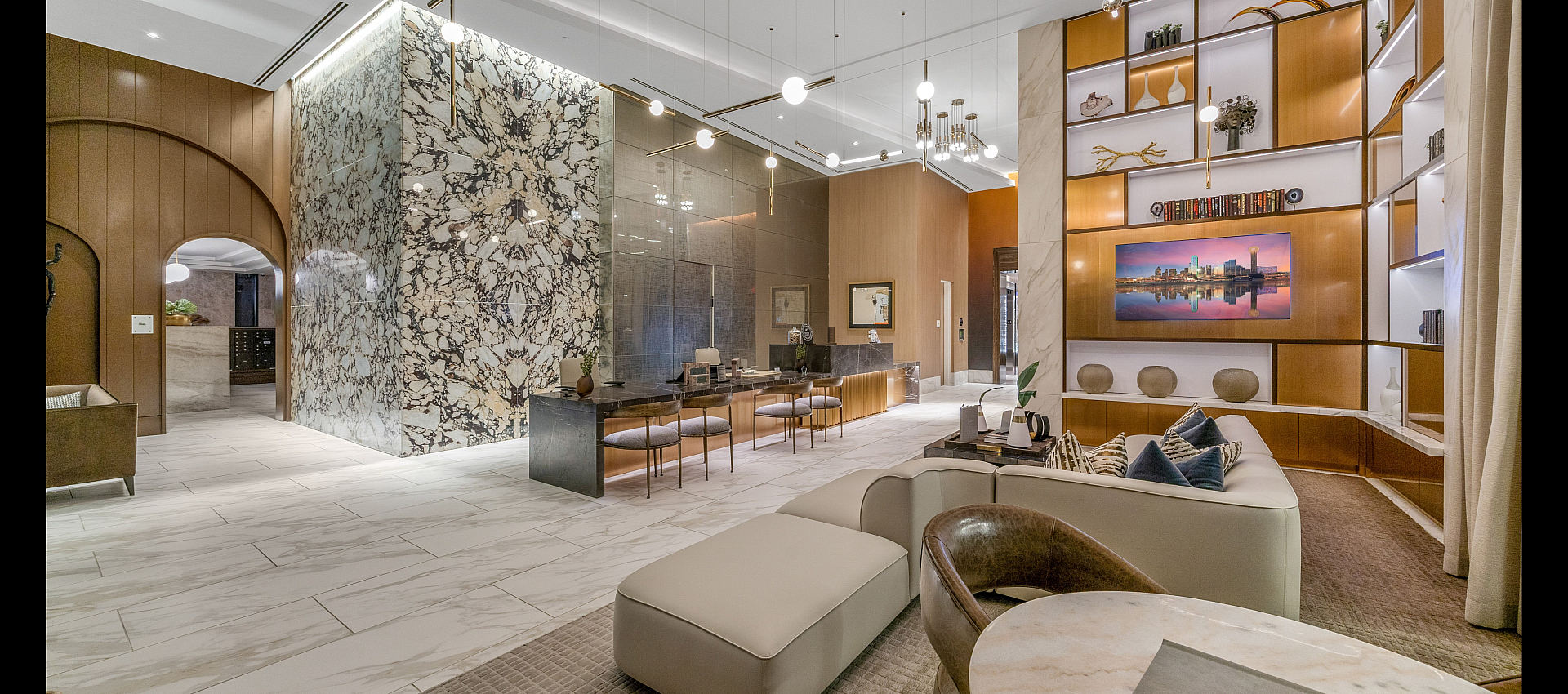 Luxurious apartment lobby with elegant marble accents, modern lighting, and stylish seating area, creating a sophisticated and inviting atmosphere.