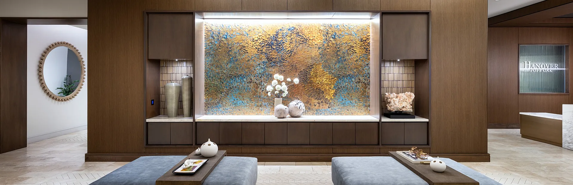 Luxurious apartment lobby featuring modern lighting, elegant decor, and comfortable seating, perfect for sophisticated urban living.