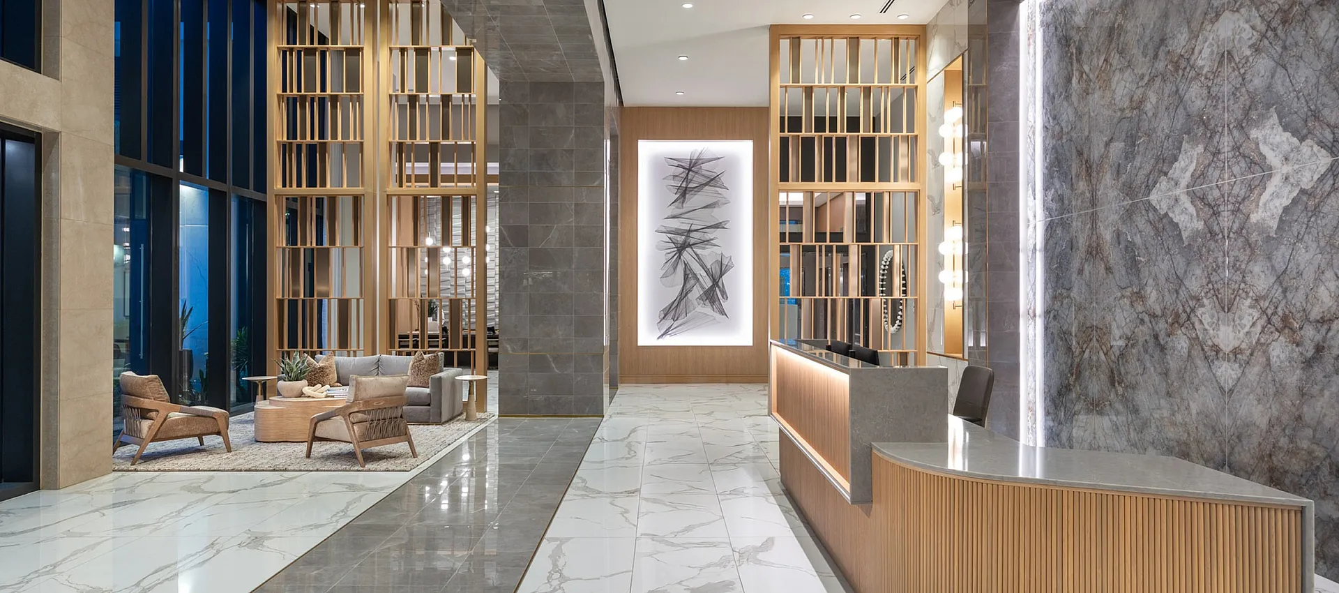 Luxurious apartment lobby with elegant marble flooring, contemporary wooden accents, and a stylish reception desk.