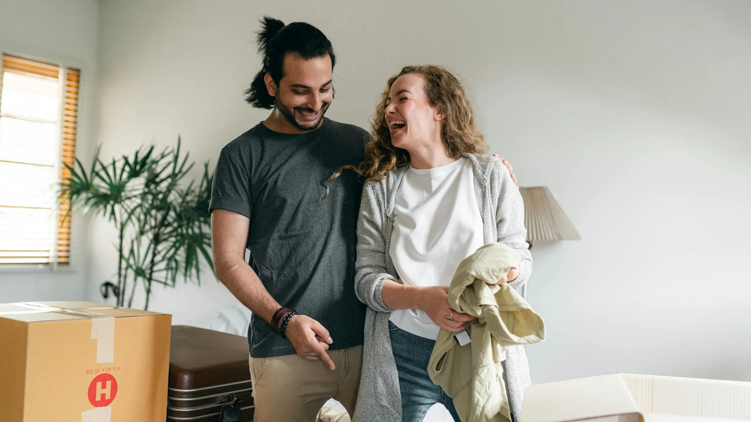 couple unpacking luggage