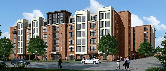 Modern brick apartment building with elegant design, surrounded by lush greenery and a clear blue sky, features spacious windows for natural light.