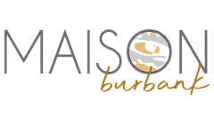 Maison Burbank elegant logo featuring artistic eye design with gold and gray accents.