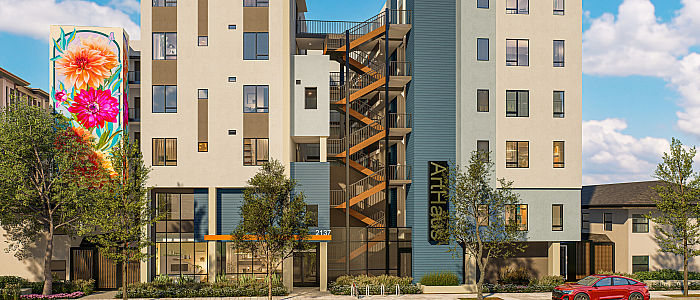 Modern apartment building with vibrant floral mural, showcasing unique architectural design and inviting urban appeal.