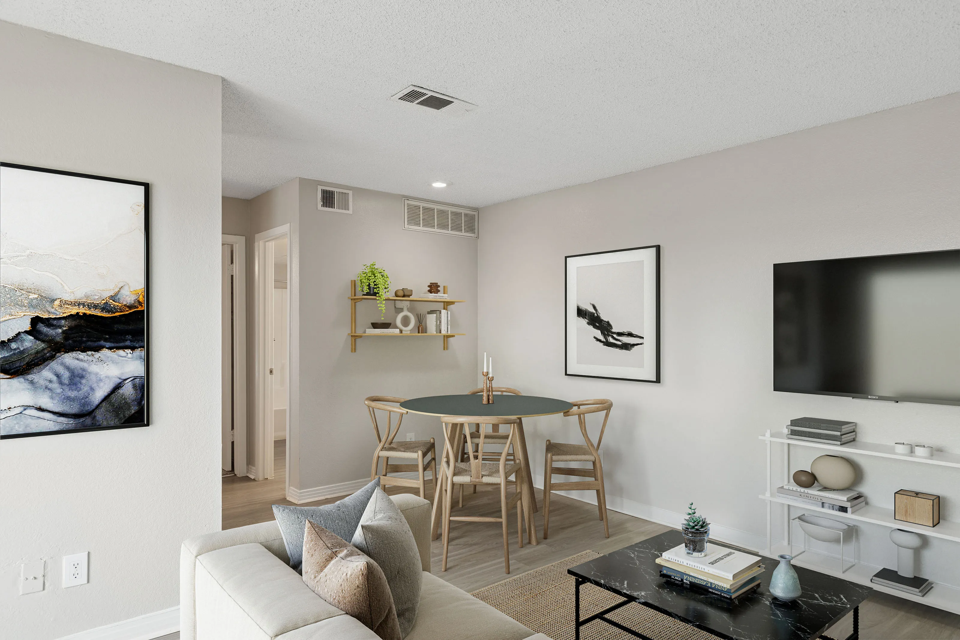 Open concept living room and dining room at ReNew Midland with modern furniture