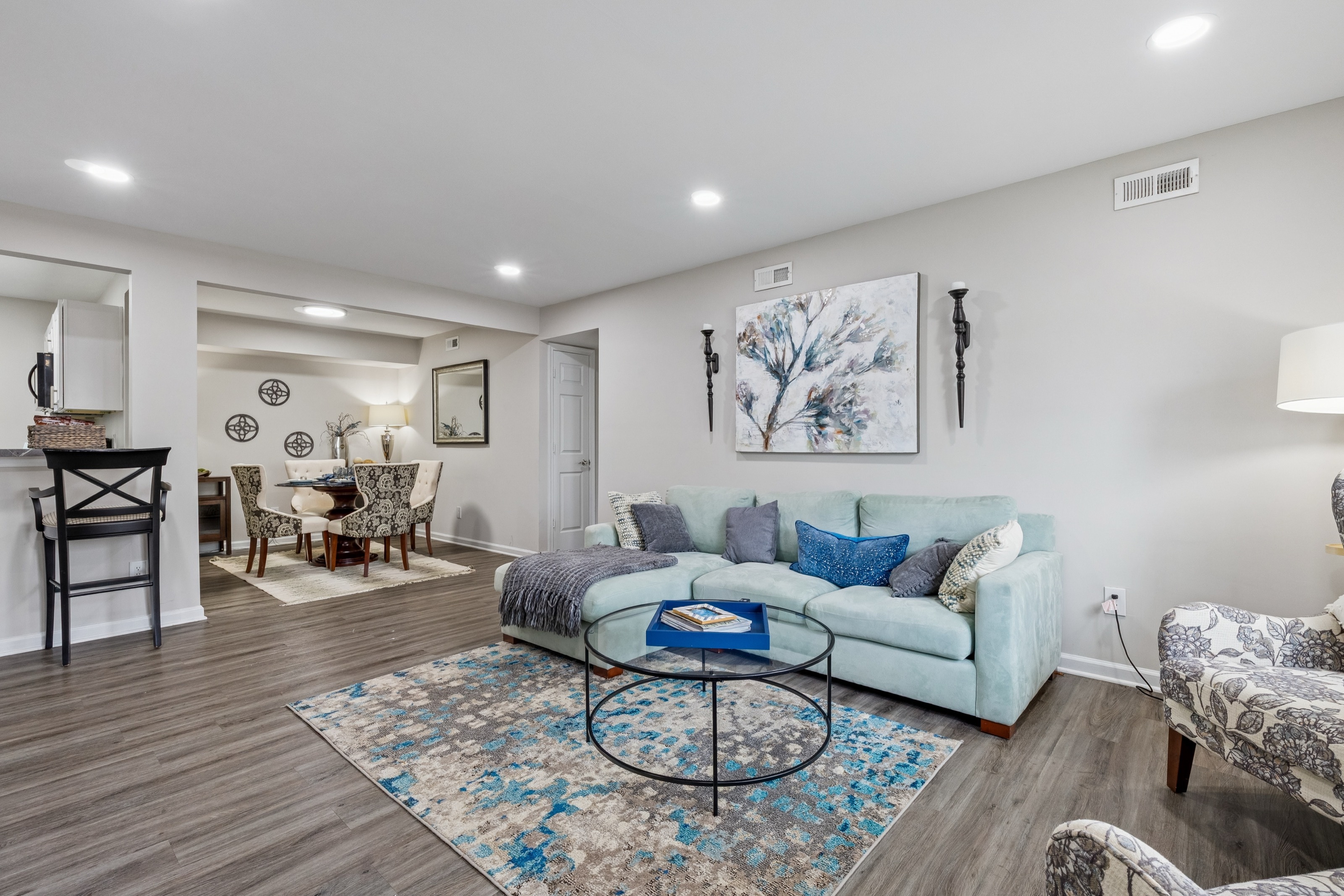 woman at home at renew arlington on her couch