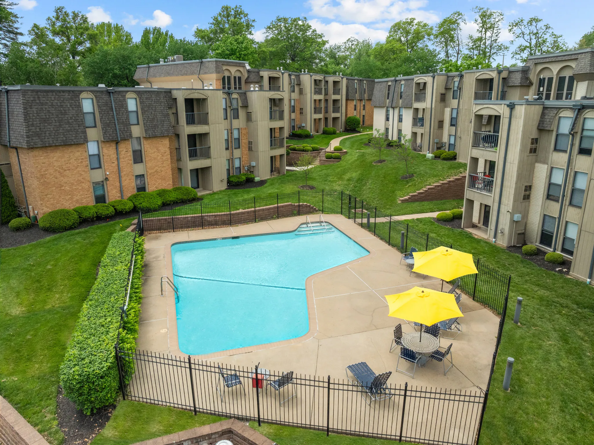 Sparkling swimming pool and sundeck at chesterfield place on a sunny day