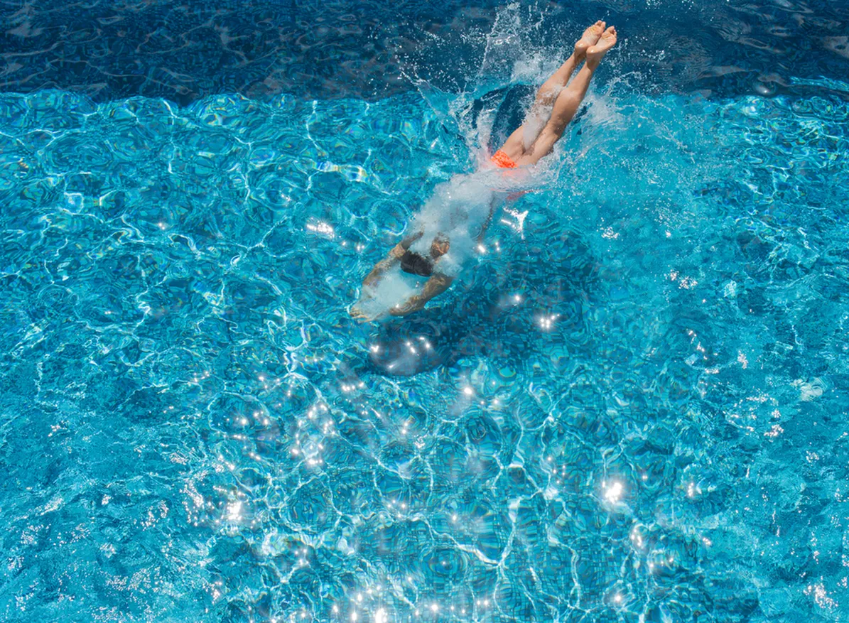 Sparkling swimming pool and sundeck at ReNew Midland on a sunny day