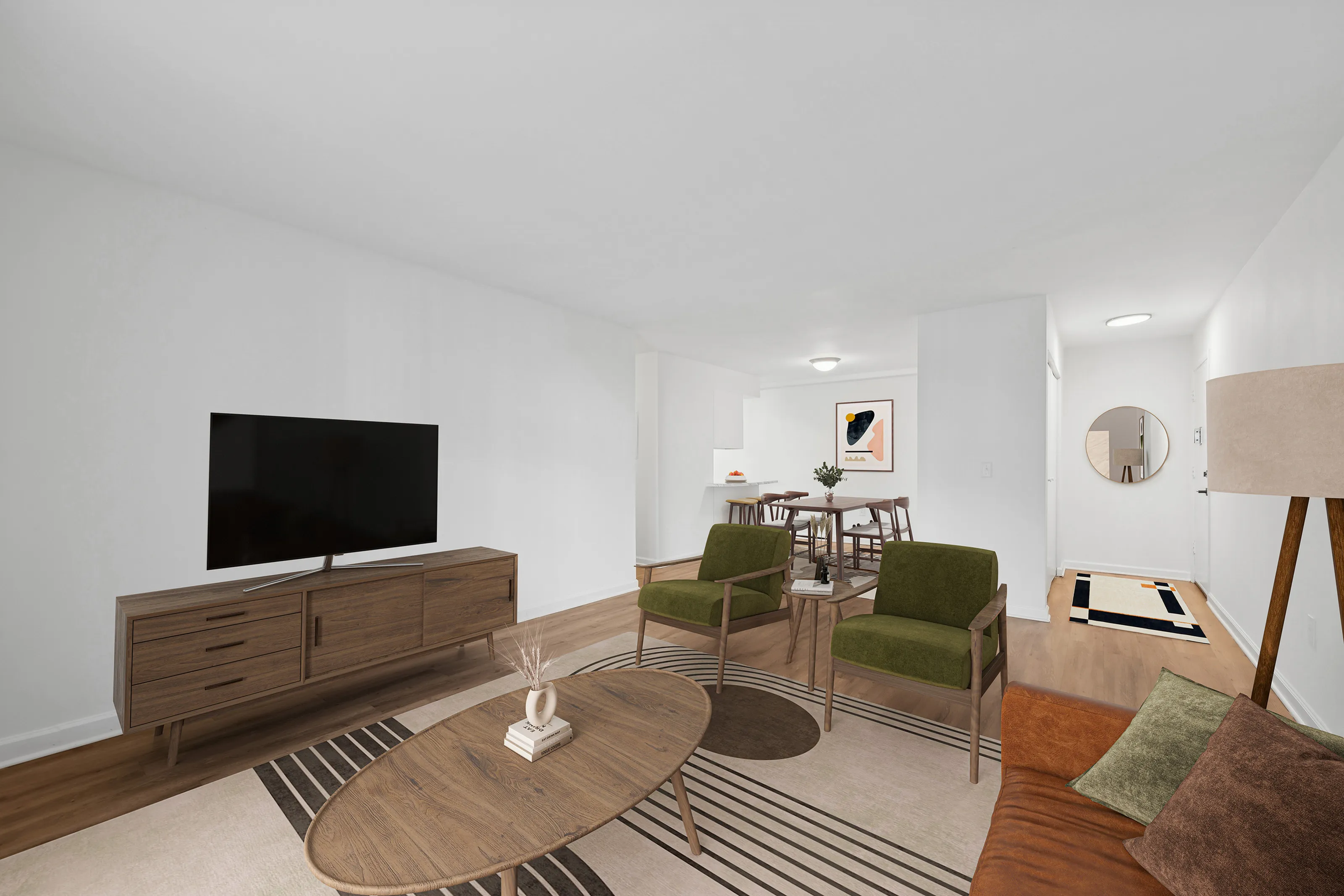 Chic living room with modern furnishings, TV setup, and dining area in an open-concept apartment.
