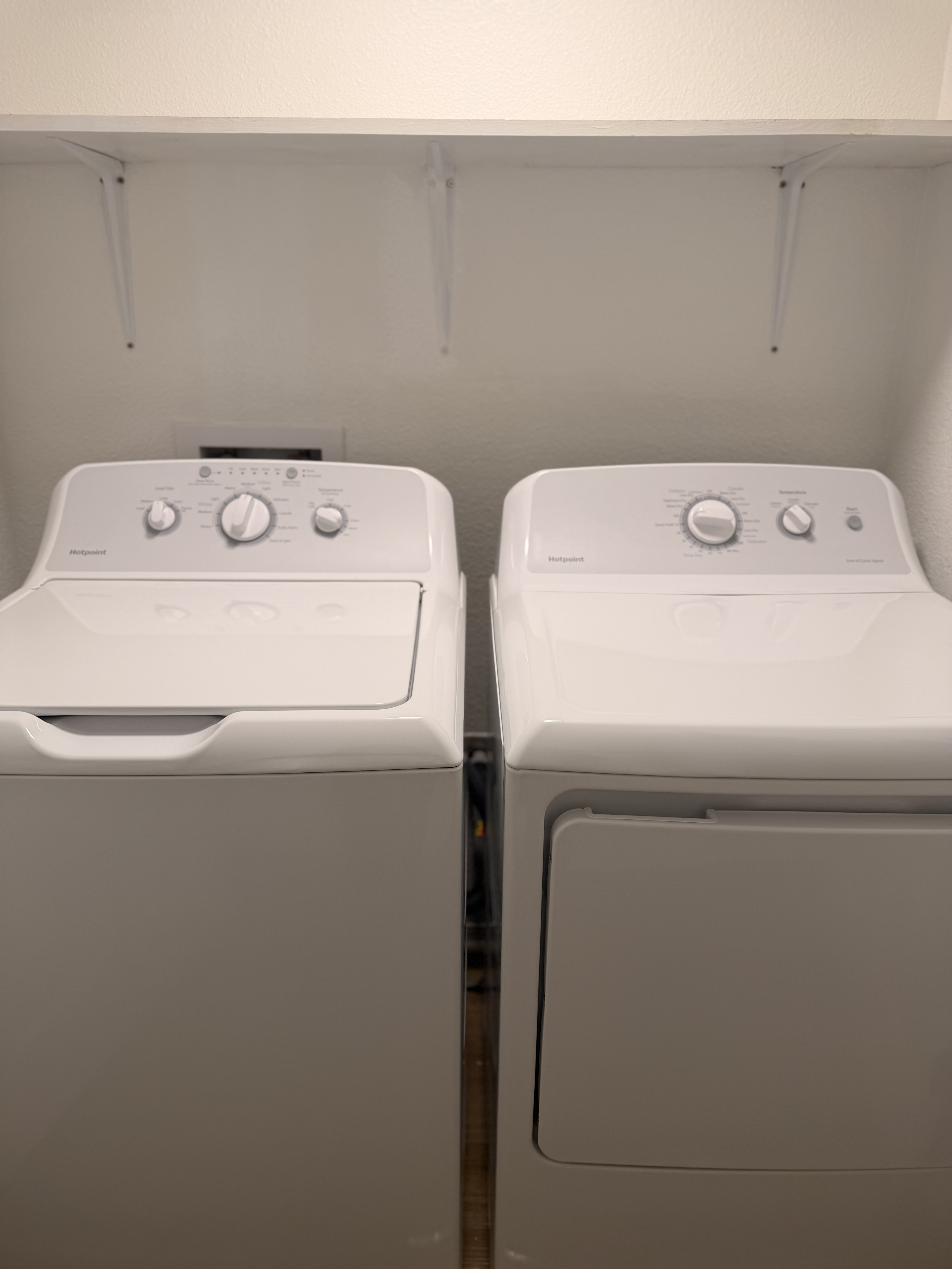 Efficient laundry room with modern washer and dryer, offering convenience and style in your apartment.