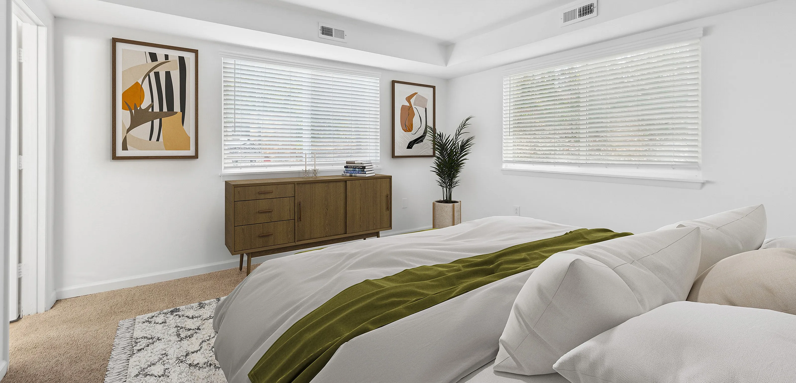 Elegant bedroom featuring a modern bed, abstract wall art, and natural light from large windows.