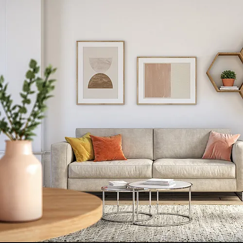 Chic living room boasting a cozy beige sofa with vibrant throw pillows, modern hexagonal shelves with plants, and elegant wall art for a stylish ambiance.
