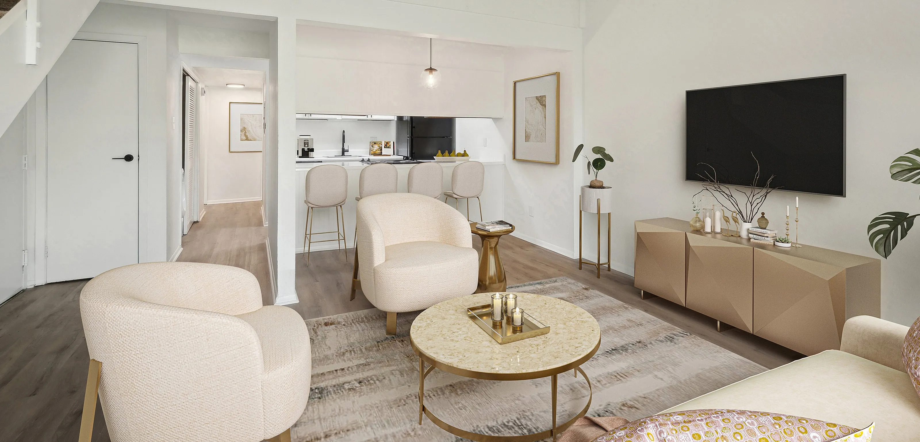 Sophisticated living room with modern furniture, open-concept kitchen, and elegant decor, showcasing bright and airy interiors.