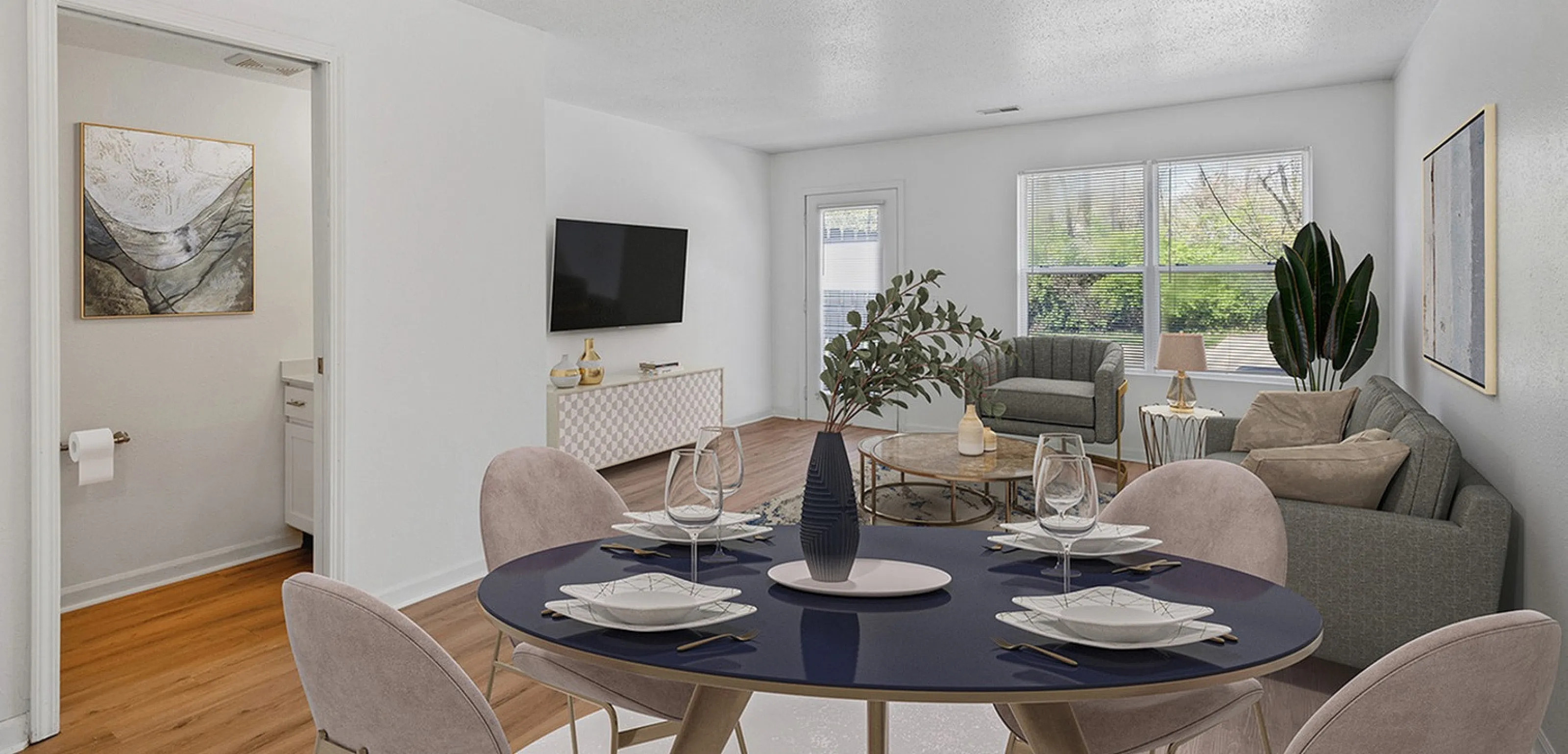 Bright, modern living and dining area with elegant decor, showcasing open space and natural light.