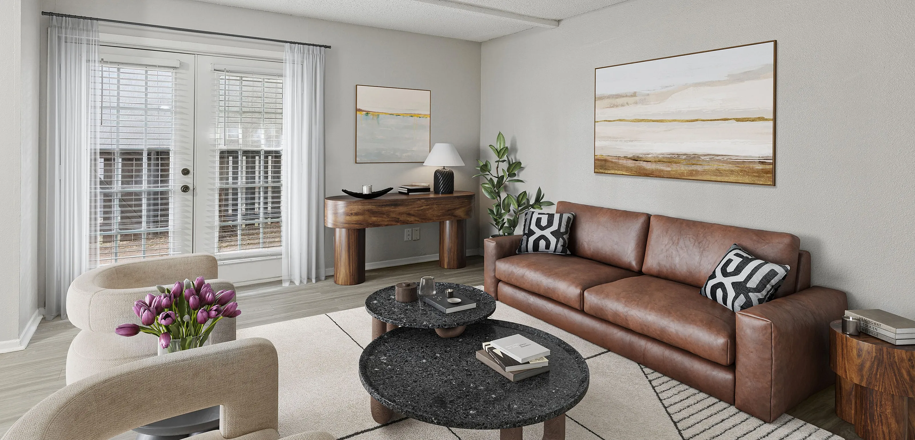 Chic living room with elegant decor, featuring a plush brown leather sofa, modern art, and large windows with sheer curtains.