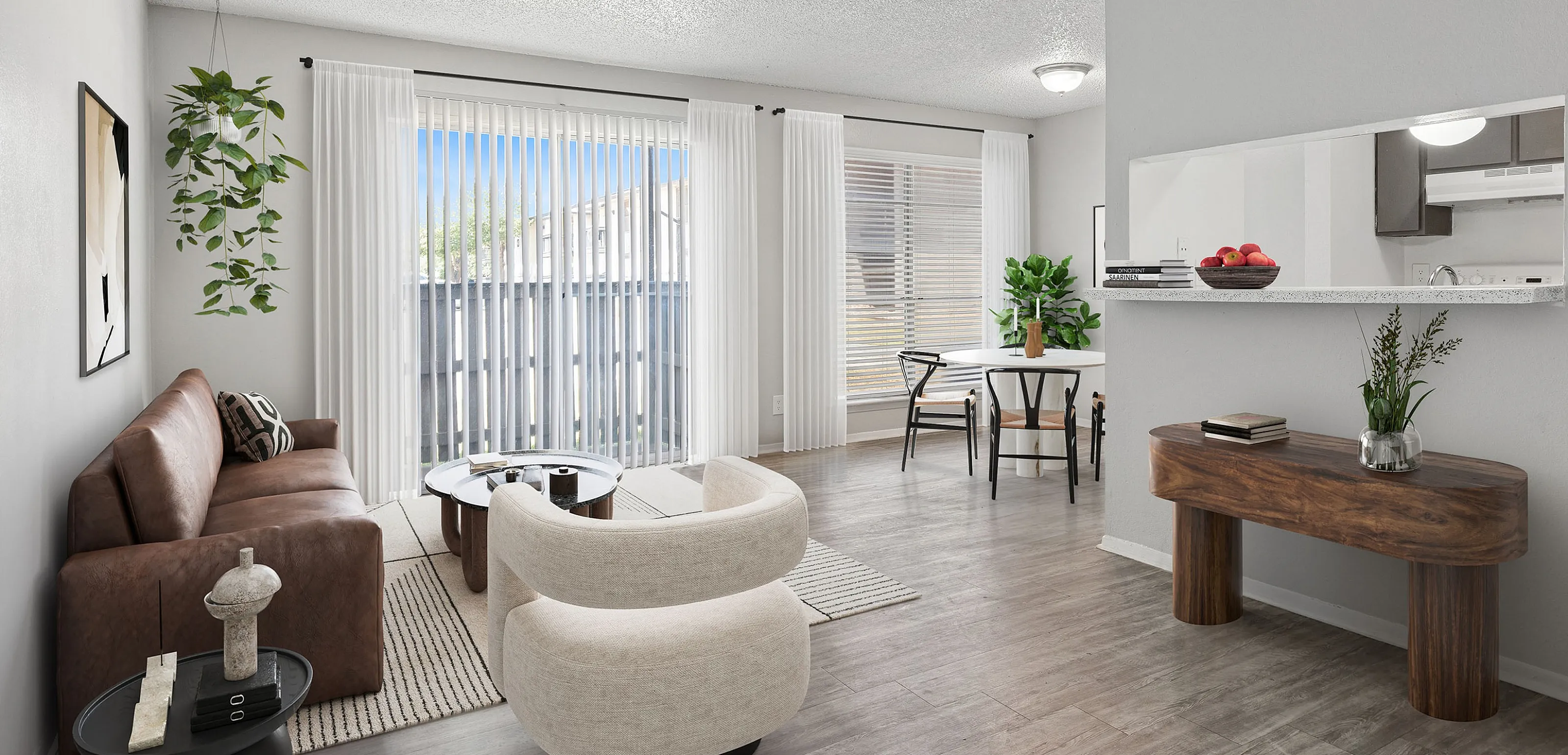 Bright and inviting open-concept living and dining area with modern decor, large windows, and elegant wood flooring.