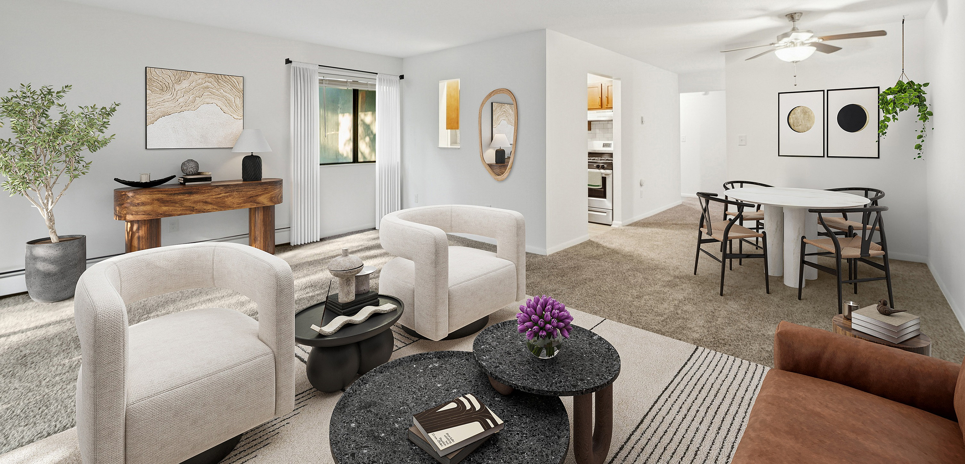 Bright, welcoming living and dining area with modern decor, cozy seating, elegant coffee table, and lush greenery, ideal for relaxation and gatherings.