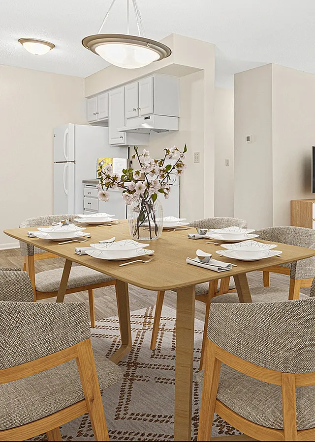 ReNew at the Grove bright and inviting open-concept dining and living area with modern decor and large windows offering lush garden views.