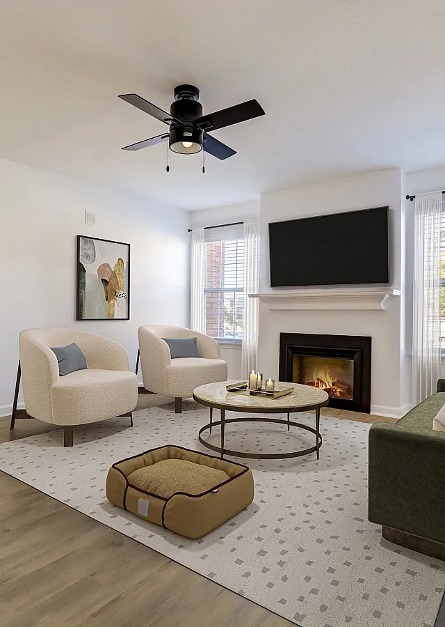 Inviting ReNew on Cantrell living room with elegant modern decor, featuring cozy seating around a stylish coffee table, complemented by a warm fireplace and a large wall-mounted TV.