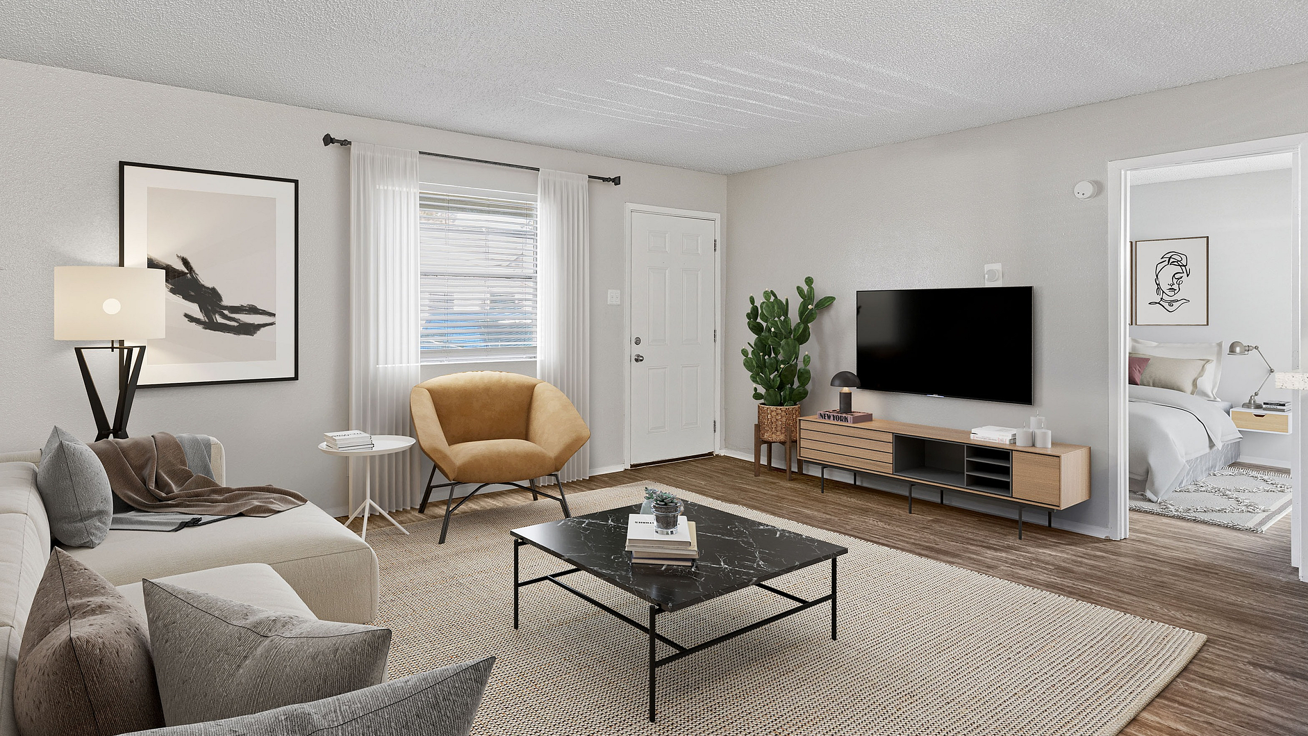 Modern living room at ReNew Heights with stylish decor, featuring a cozy beige sofa, chic mustard armchair, elegant black coffee table, and a minimalist entertainment center. Bright natural light floods through a window with sheer curtains,