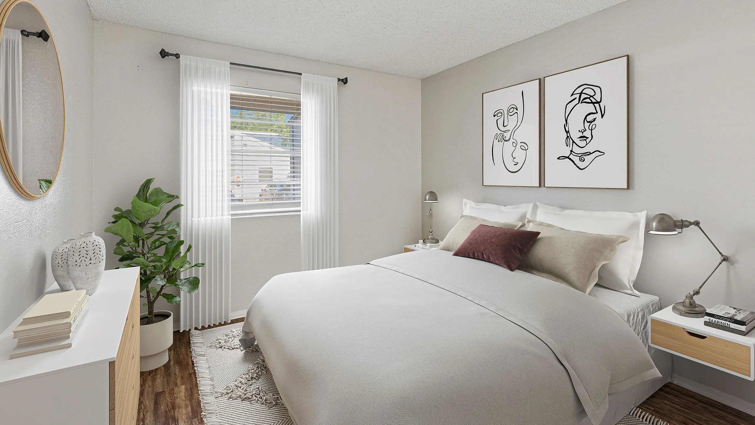 Elegant bedroom at ReNew Heights with a plush bed, modern artwork, and abundant natural light from a window with sheer curtains.
