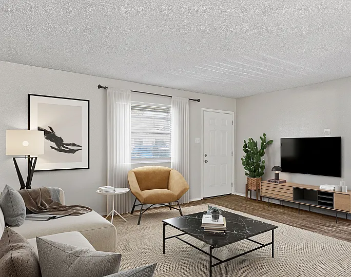 Charming living room at ReNew Heights with modern decor, cozy seating area, and natural lighting.