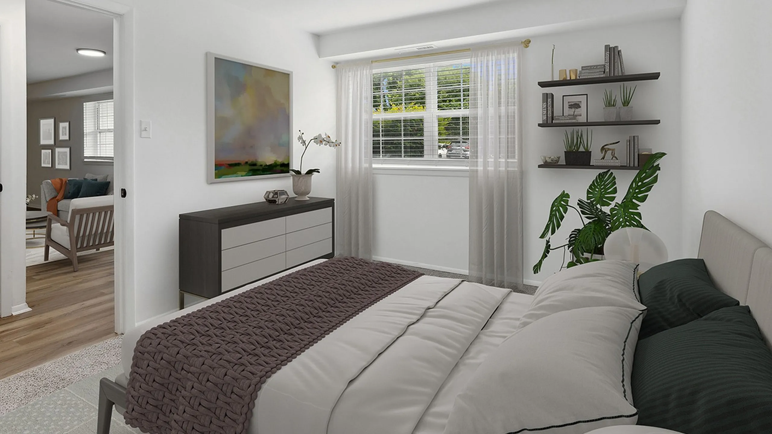 Bright and inviting bedroom at ReNew Parkville with modern decor, lush green plant, and an abundance of natural light through large window.