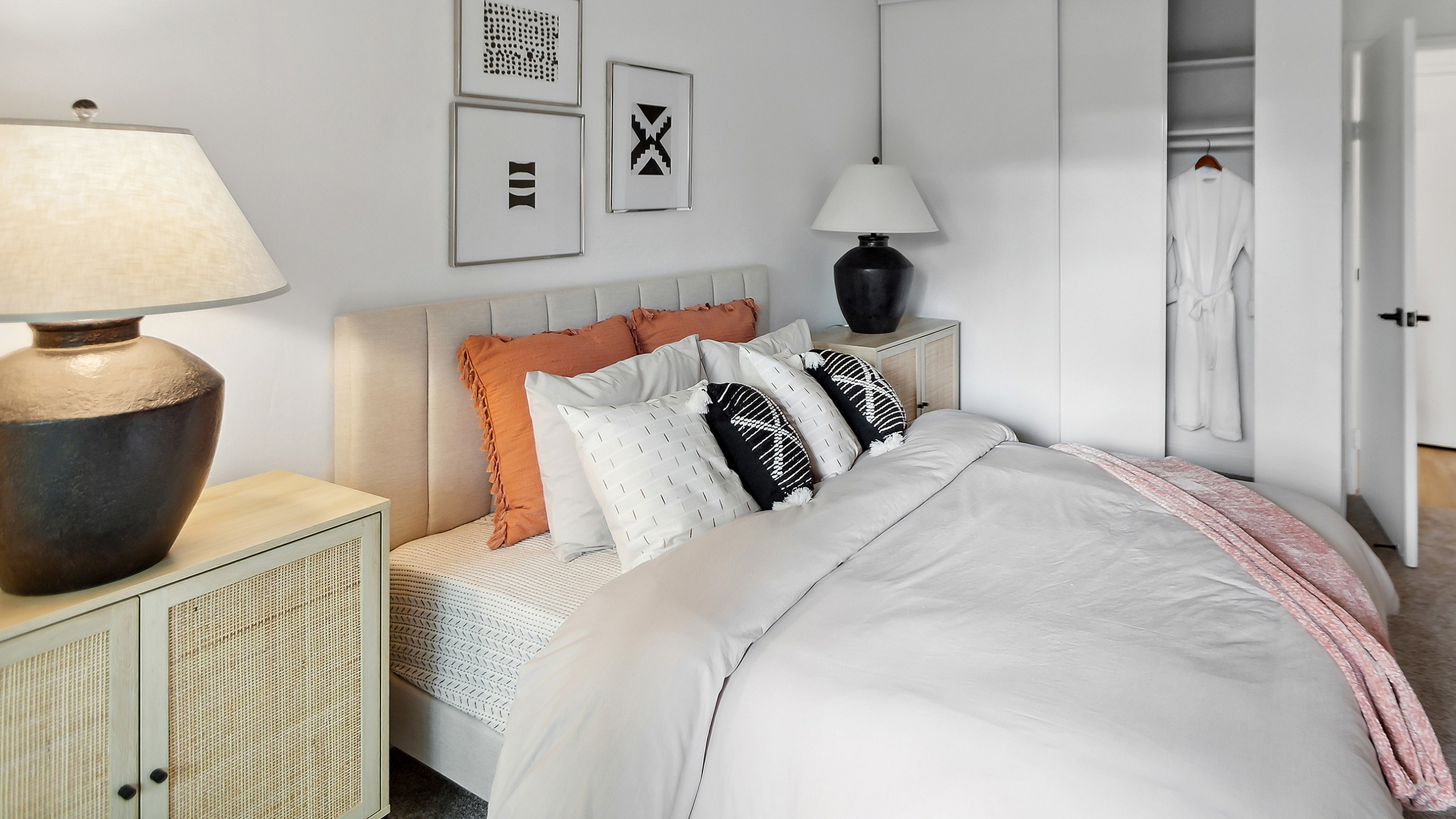 Elegant bedroom at ReNew Berryessa  with modern decor, featuring cozy bedding and stylish wall art, perfect for a restful retreat.