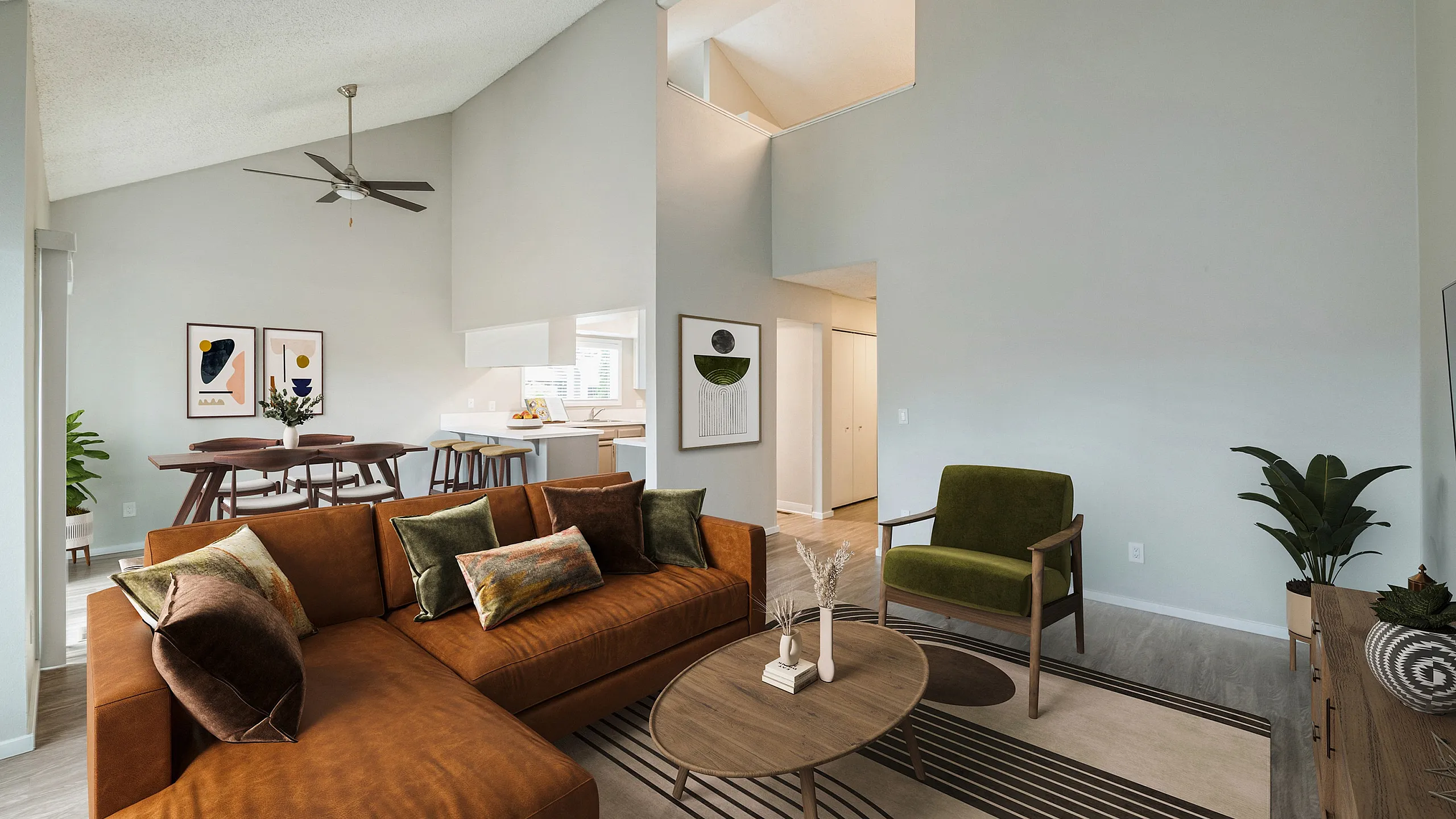 Chic open-concept apartment at ReNew Rock Creek with modern furniture, stylish decor, and bright natural lighting perfect for relaxed living.