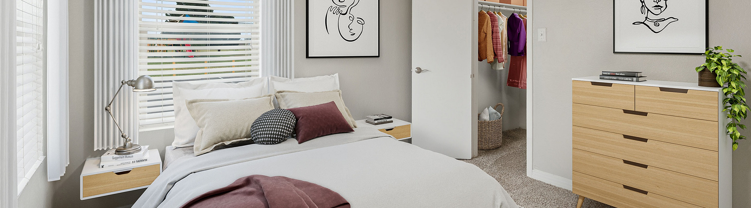 Elegant bedroom at ReNew Midland  with modern decor, plush bedding, and ample natural light from large windows, featuring a stylish open closet and chic wall art.
